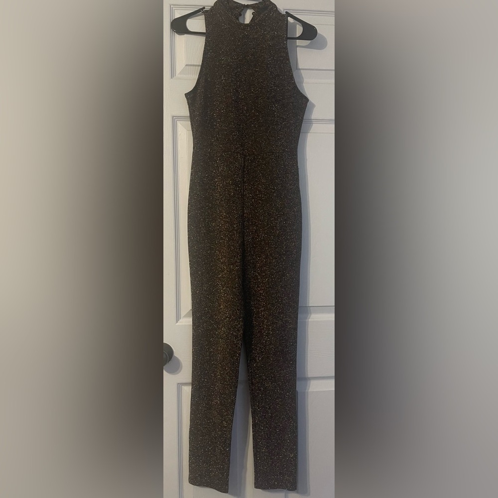 New Years Eve romper with open back only missing one button only worn once.